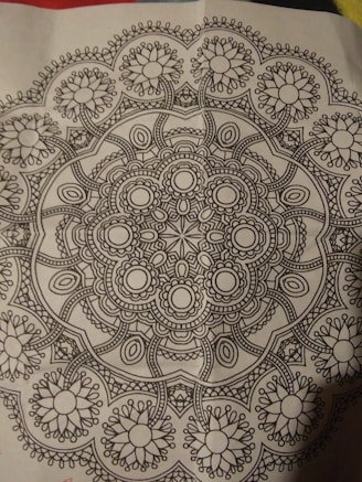 A close-up of a printable coloring page with intricate patterns and soft lines.
