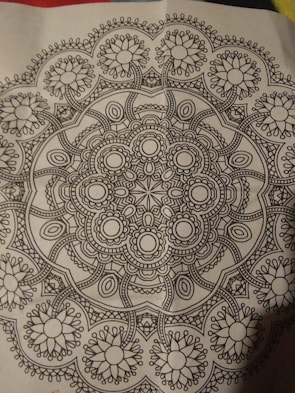 A detailed black and white mandala ready for coloring.