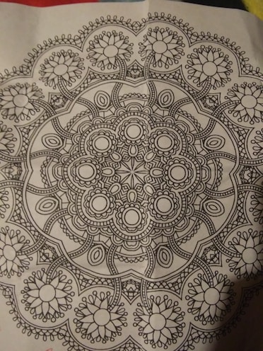 A close-up of a printable coloring page with intricate patterns and soft lines.