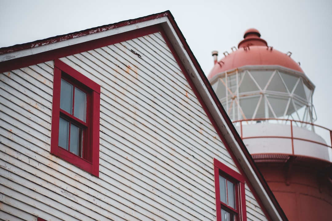 shallow focus photo of white wooden 2-story house