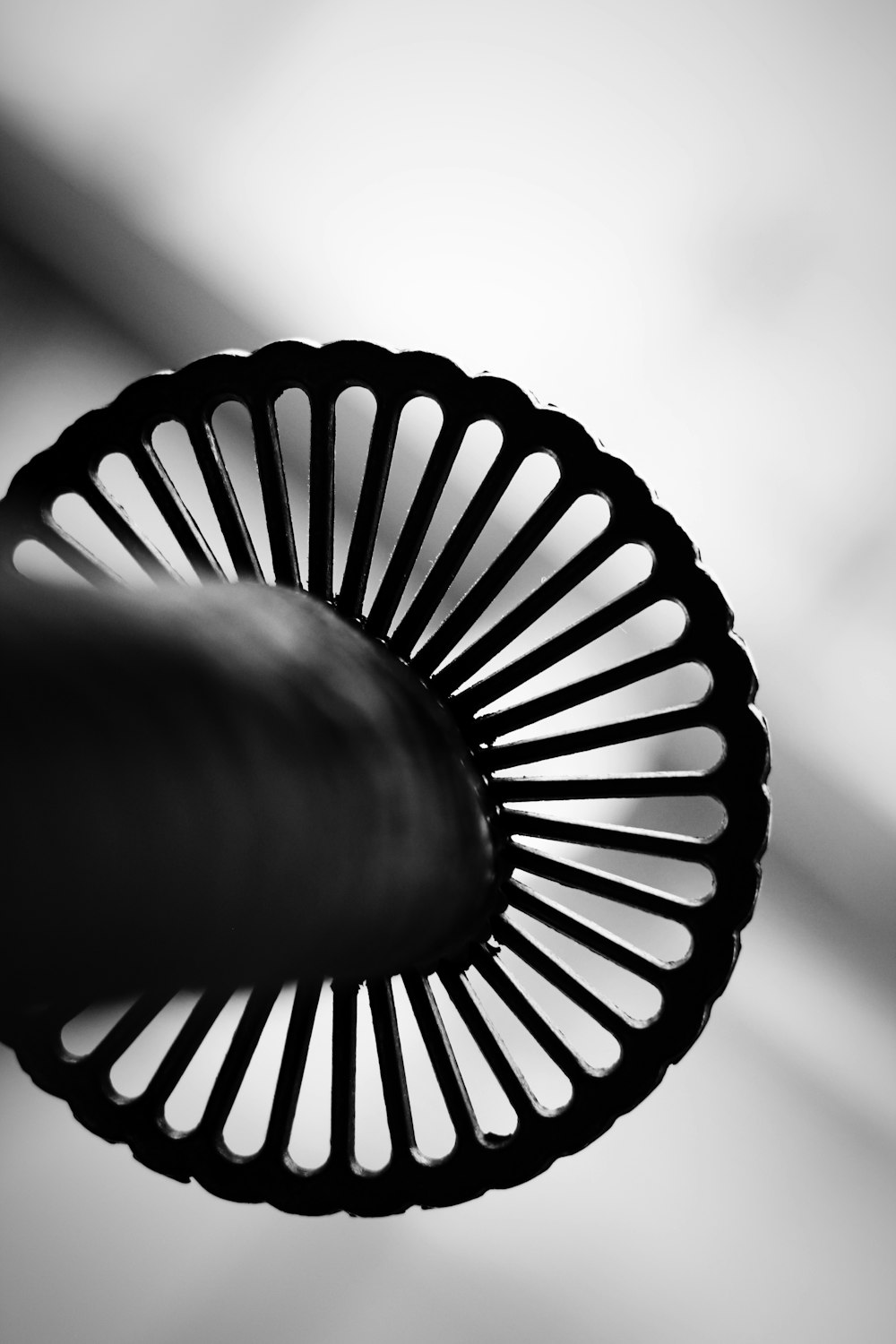 a black and white photo of a fan