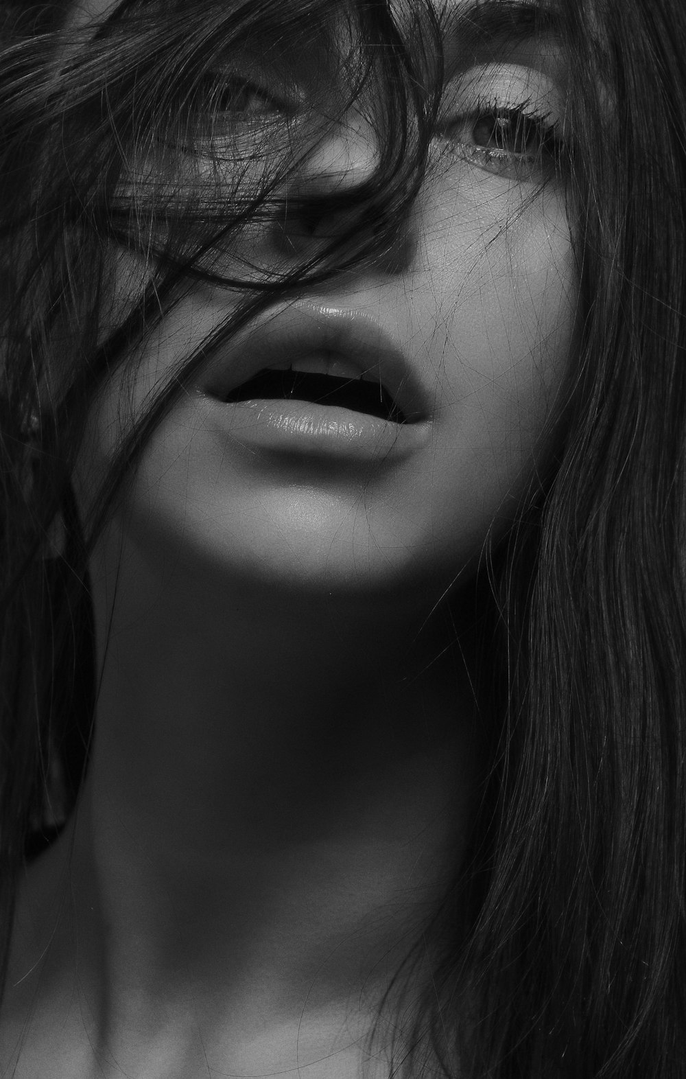 grayscale photography of woman with hair on face