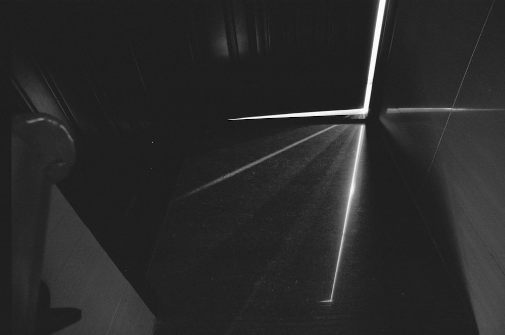 a black and white photo of a hallway