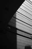 Black and white photograph capturing geometric patterns in architecture.