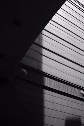 Black and white photograph capturing geometric patterns in architecture.