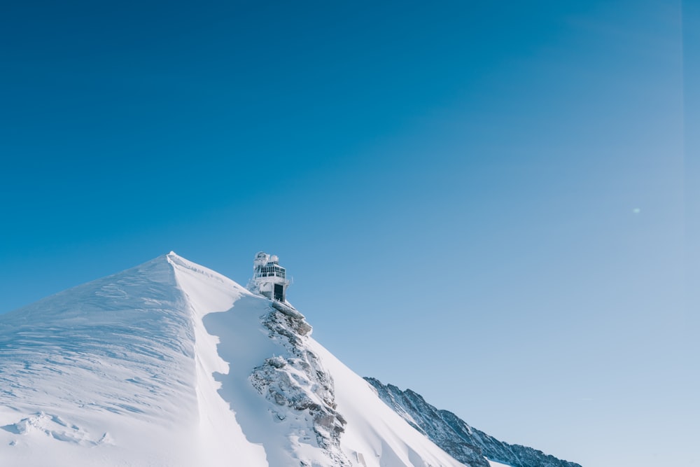 concrete structure on snow-covered mountain