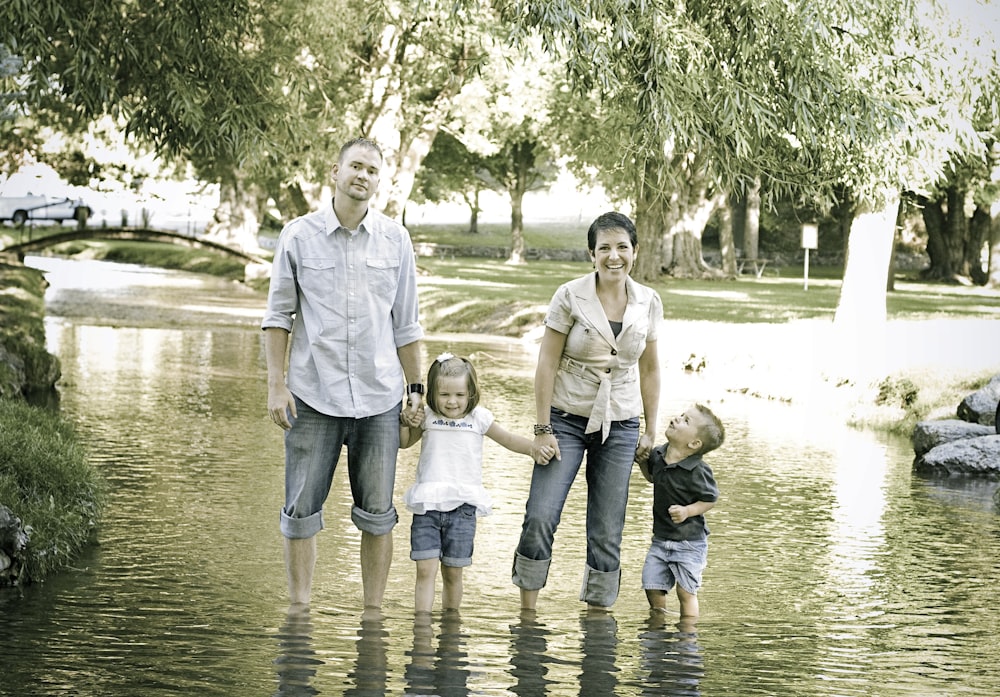 man and woman standing on stream