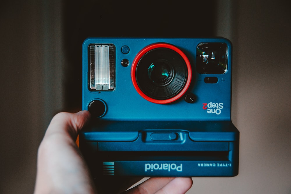blue, black, and red Polaroid One Step camera photo – Free The upside down  Image on Unsplash