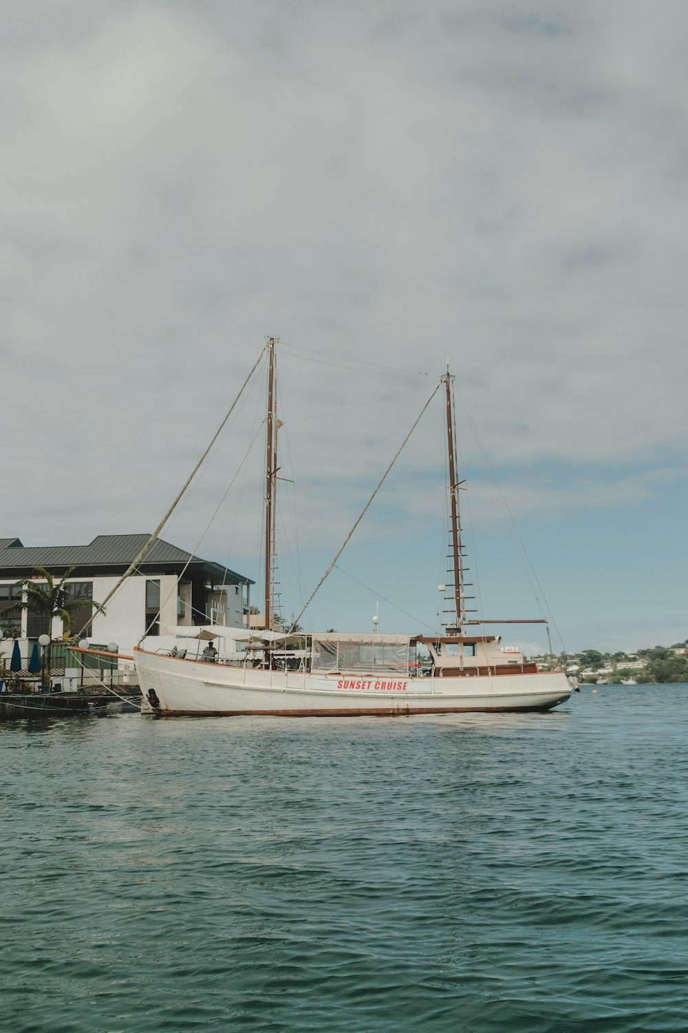 white boat floating on sea