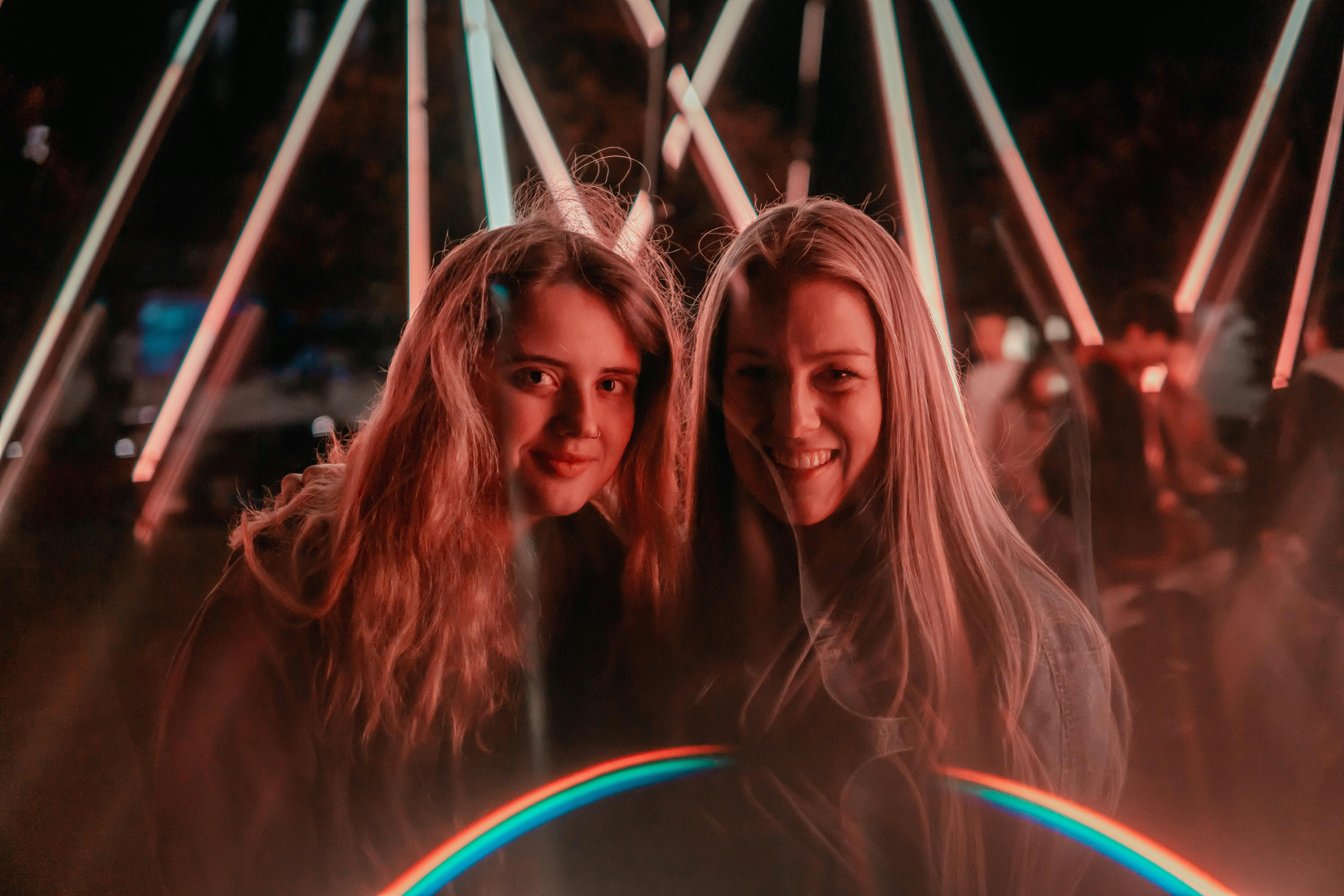 Guests posing in a disco-themed photo booth