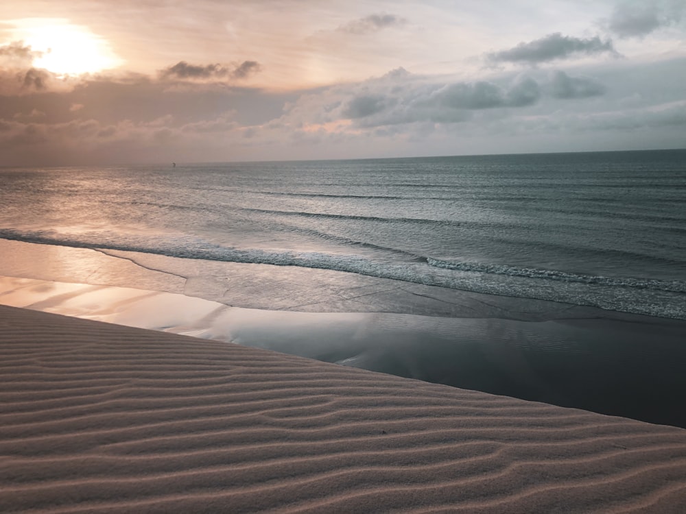 sand shore during golden hour