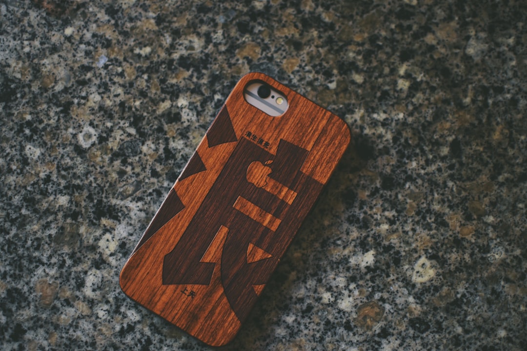 brown plastic phone case close-up photography