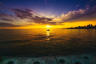 silhouette photography of boat on body of water