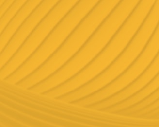 a yellow background with wavy lines