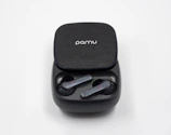 Modern wireless earbuds resting inside their compact charging case
