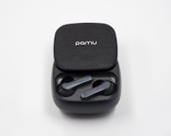 Stylish wireless earbuds resting in their charging case.