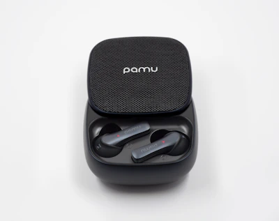 A pair of wireless earbuds resting inside a compact charging case