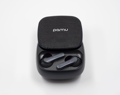 Close-up of a pair of sleek, modern earbuds with a charging case.