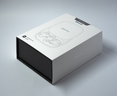 A sleek, modern black and gold branded box featuring the alpha bud club logo on a deep green background.