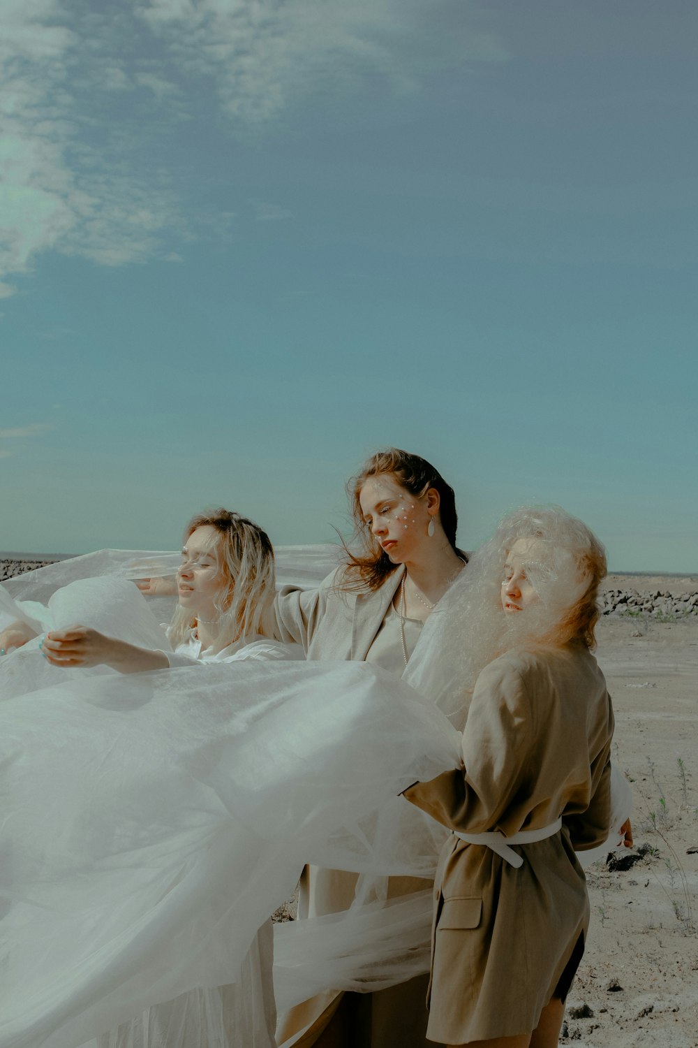 three women on shoreine