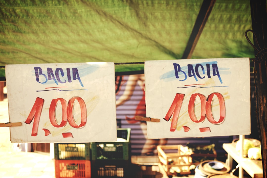 bacia 1.00 price signs on rope below green canopy