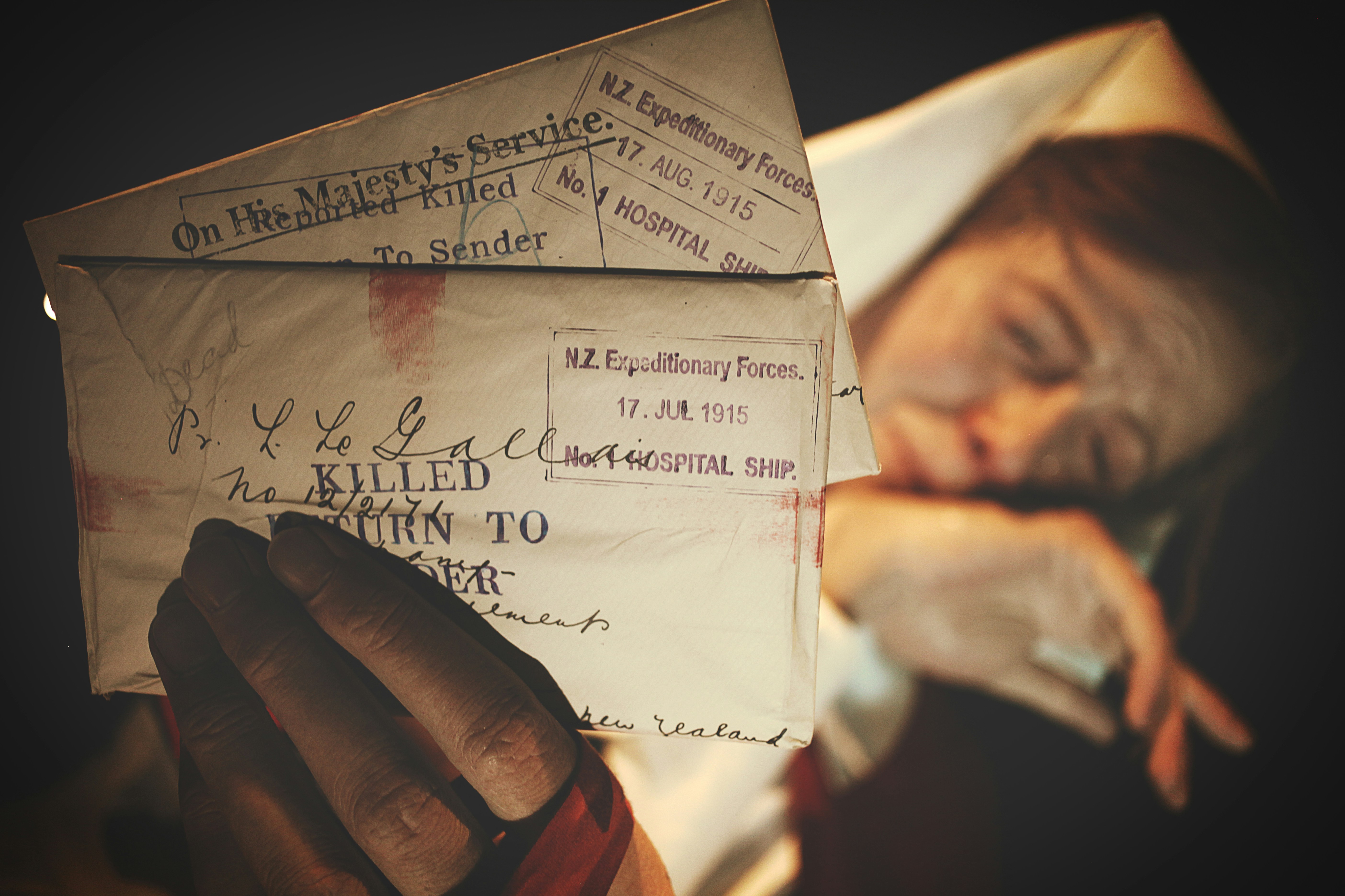 woman holding white mail letters