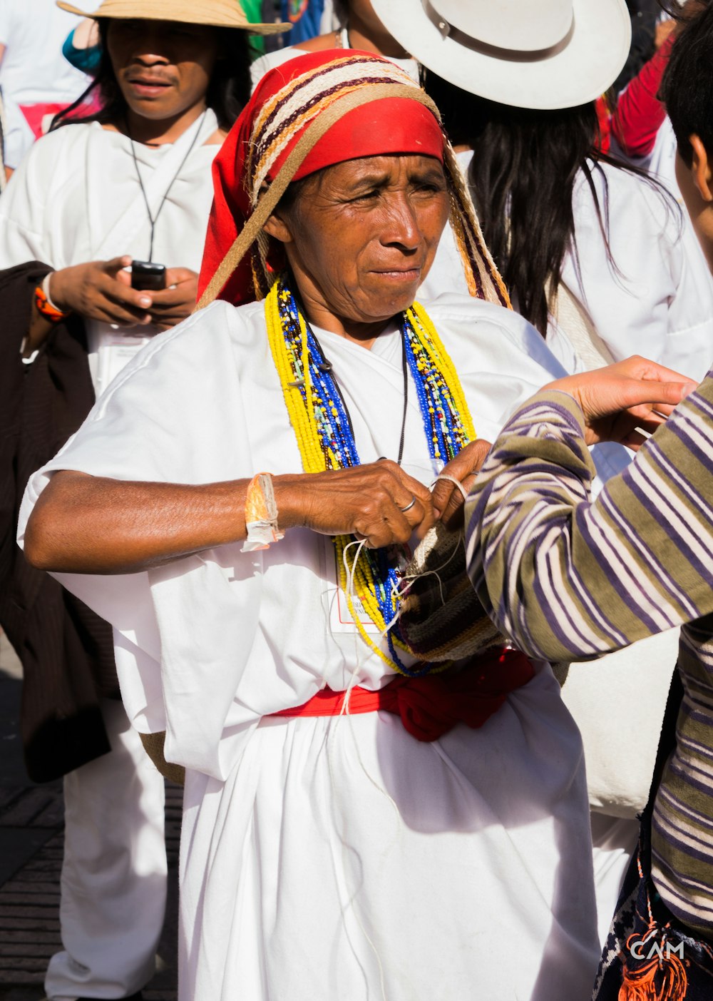 woman wearing white dress and red bandana