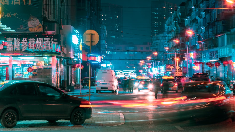 a car driving down a city street at night