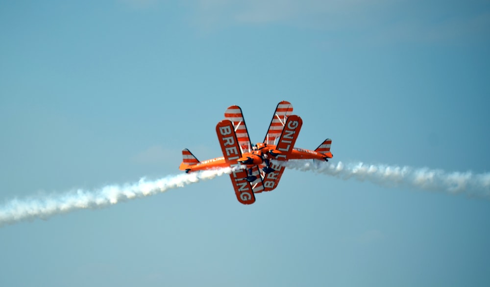 two orange airplanes