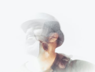 a blurry photo of a man with a hat
