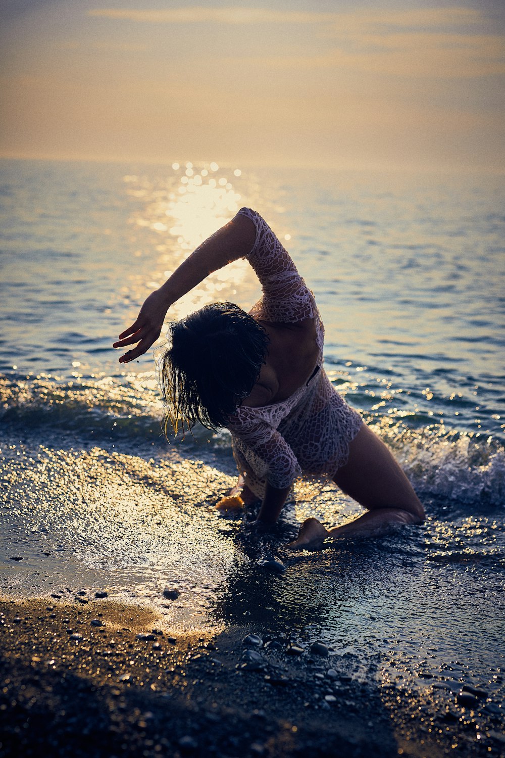 woman sitting on shore