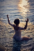woman sitting on seashore