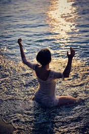 woman sitting on seashore