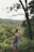 man standing beside tree