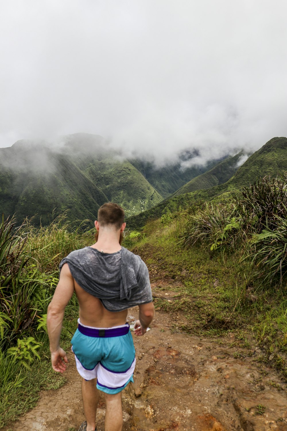 man walking on trail