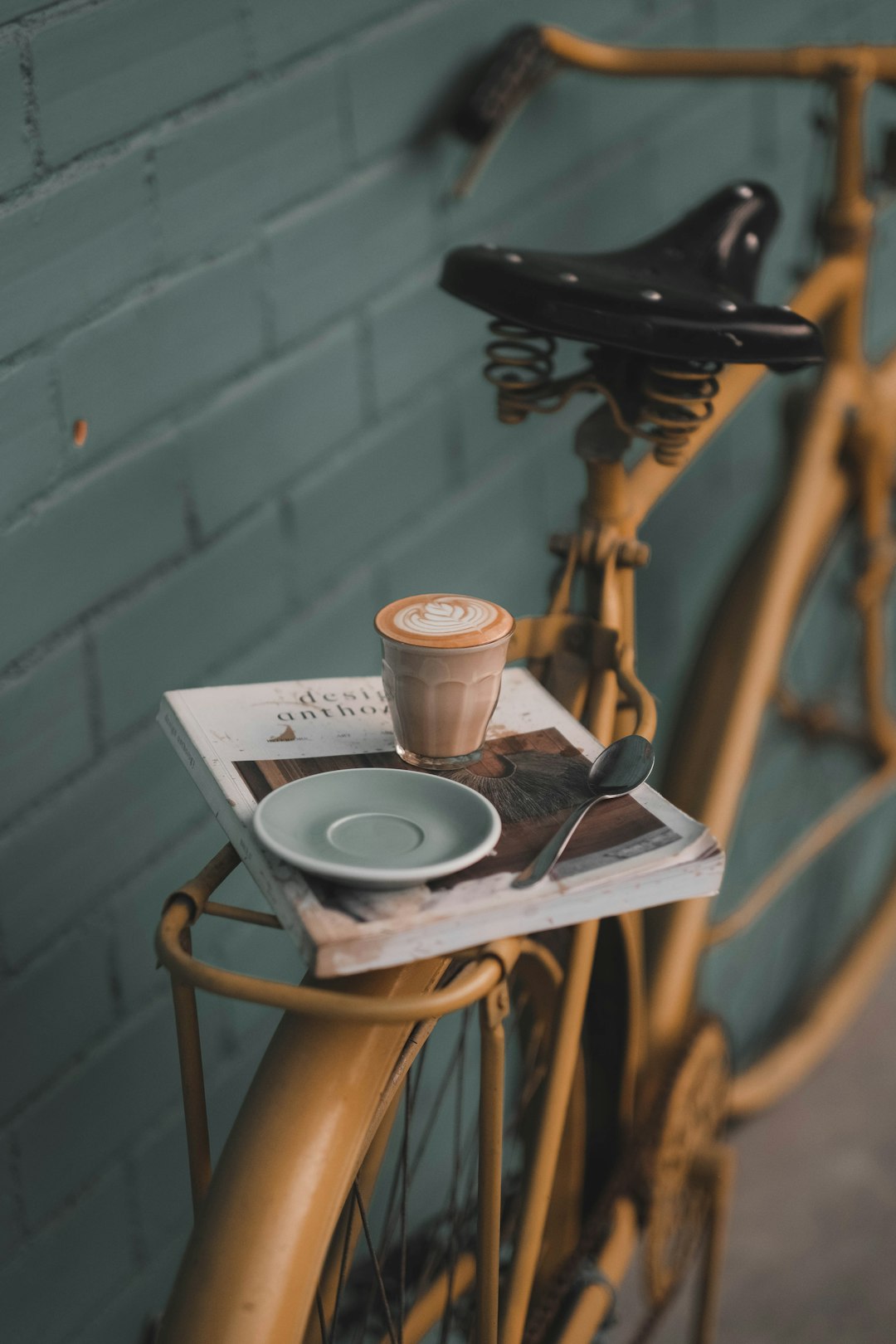 filled cup near saucer on bike