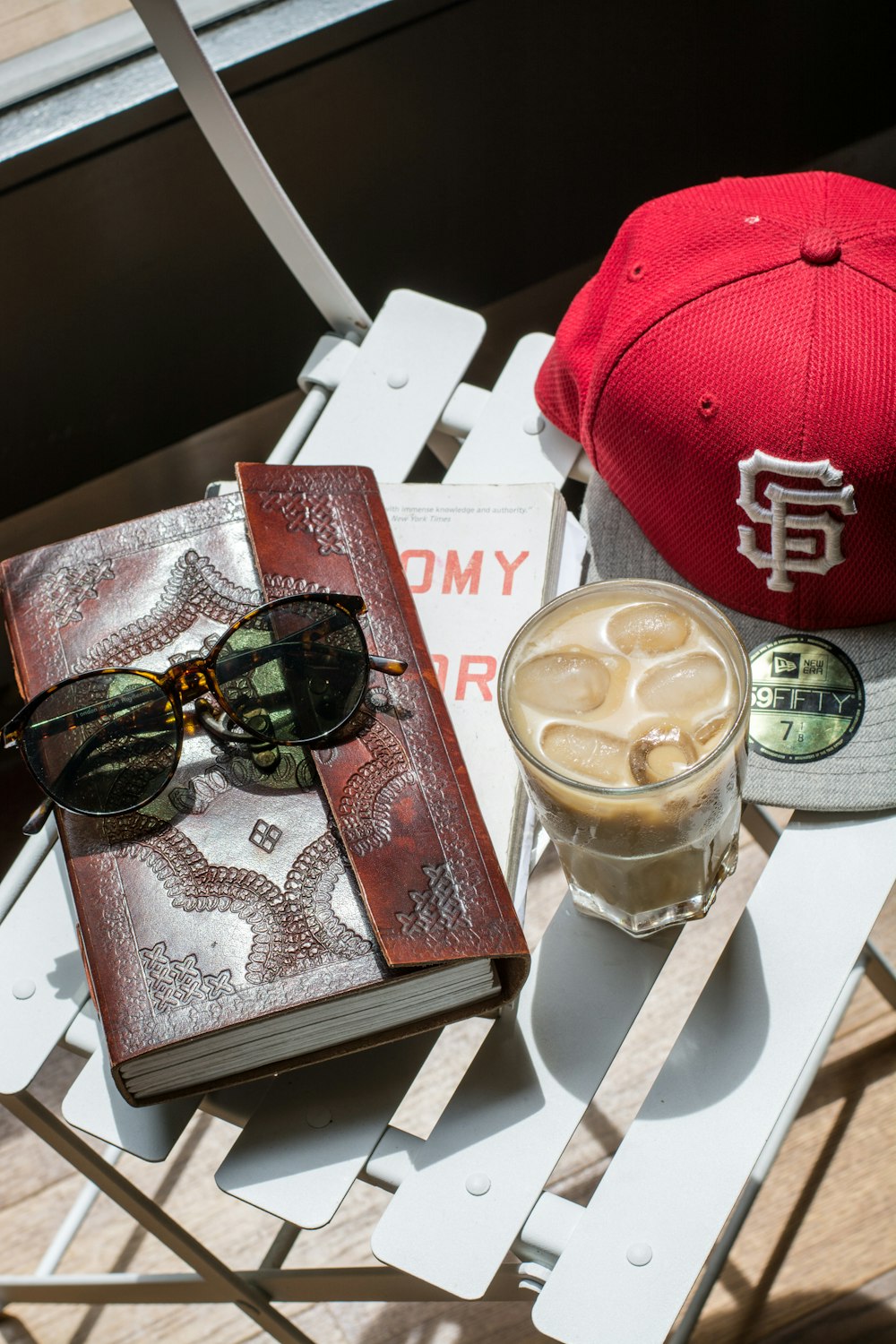 sunglasses on leather book