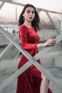 woman standing near metal fence