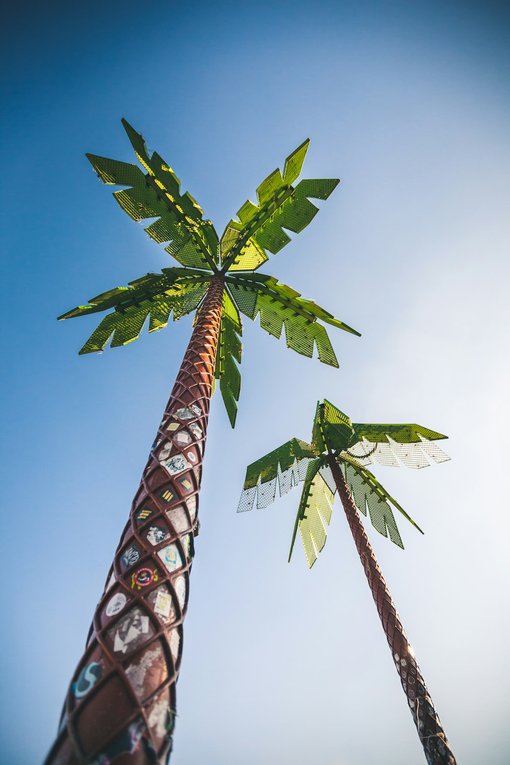 2 green metal trees