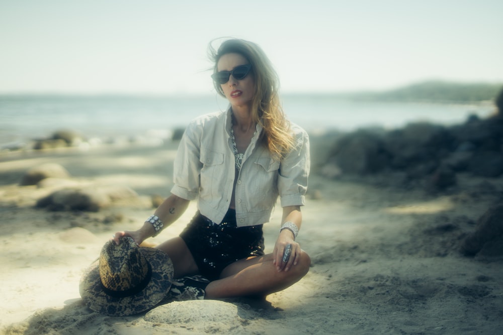 woman sitting on seashore