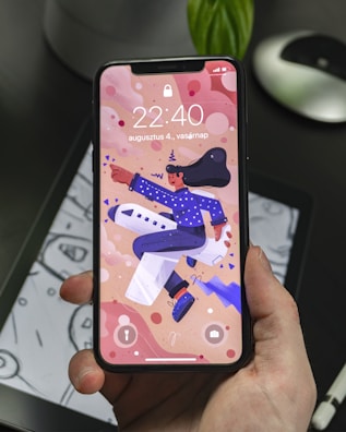 Mobile phone displaying a colorful, artistic wallpaper from wonderjoy studio