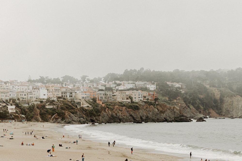 people on shore near body of water