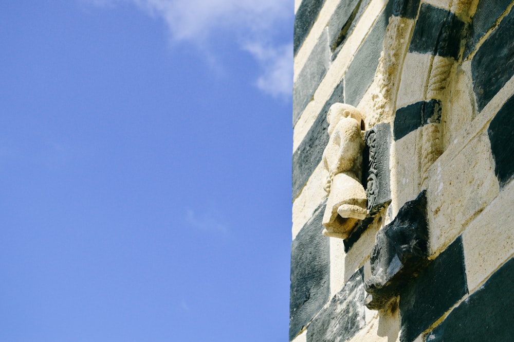 a close up of a building with a sky in the background