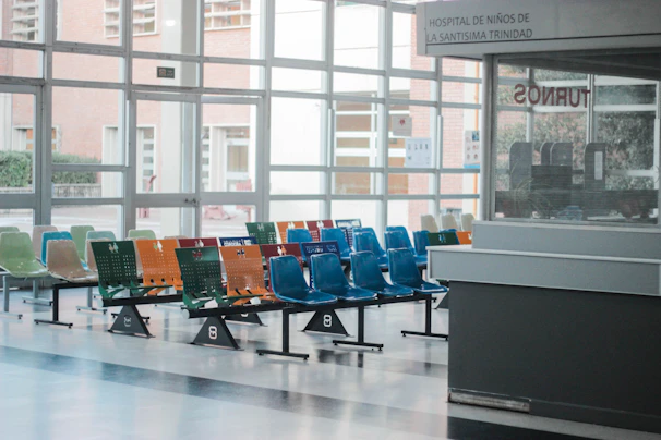 Modern hospital waiting area with comfortable seating and natural light