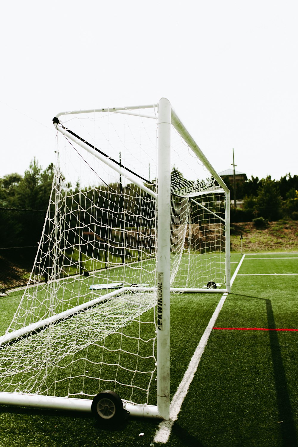 white goalie net with red line