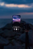 Smartphone on a tripod capturing a night sky full of stars
