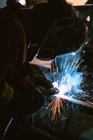 person wearing welding mask photo