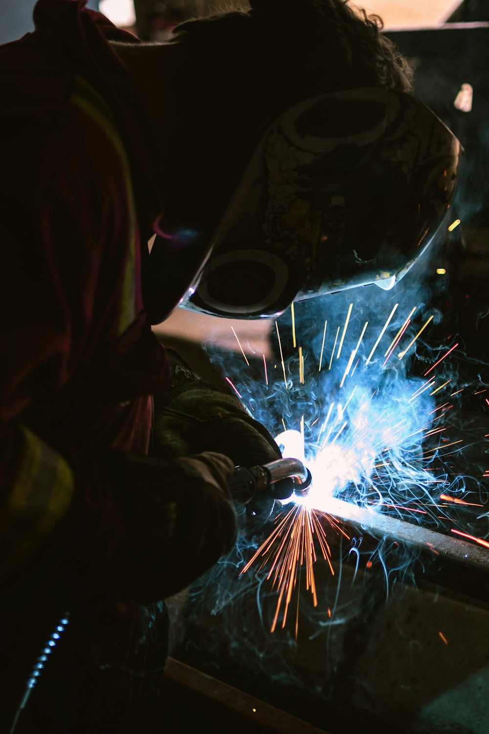 person wearing welding mask photo