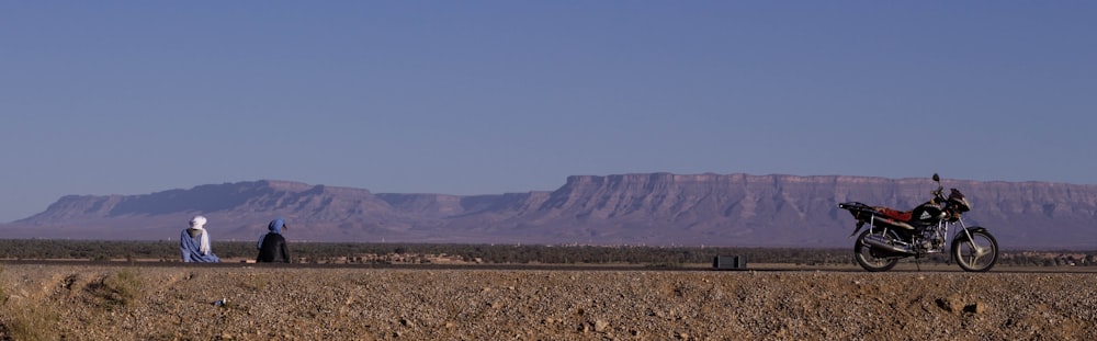 black and red motorcyle on desert