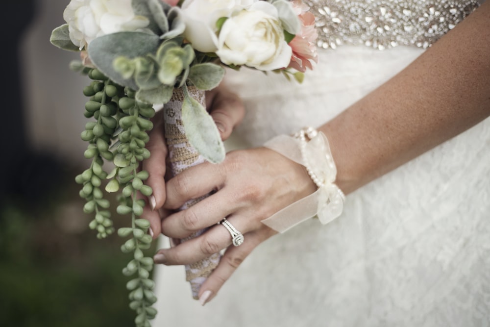 woman holding bouquet of flower